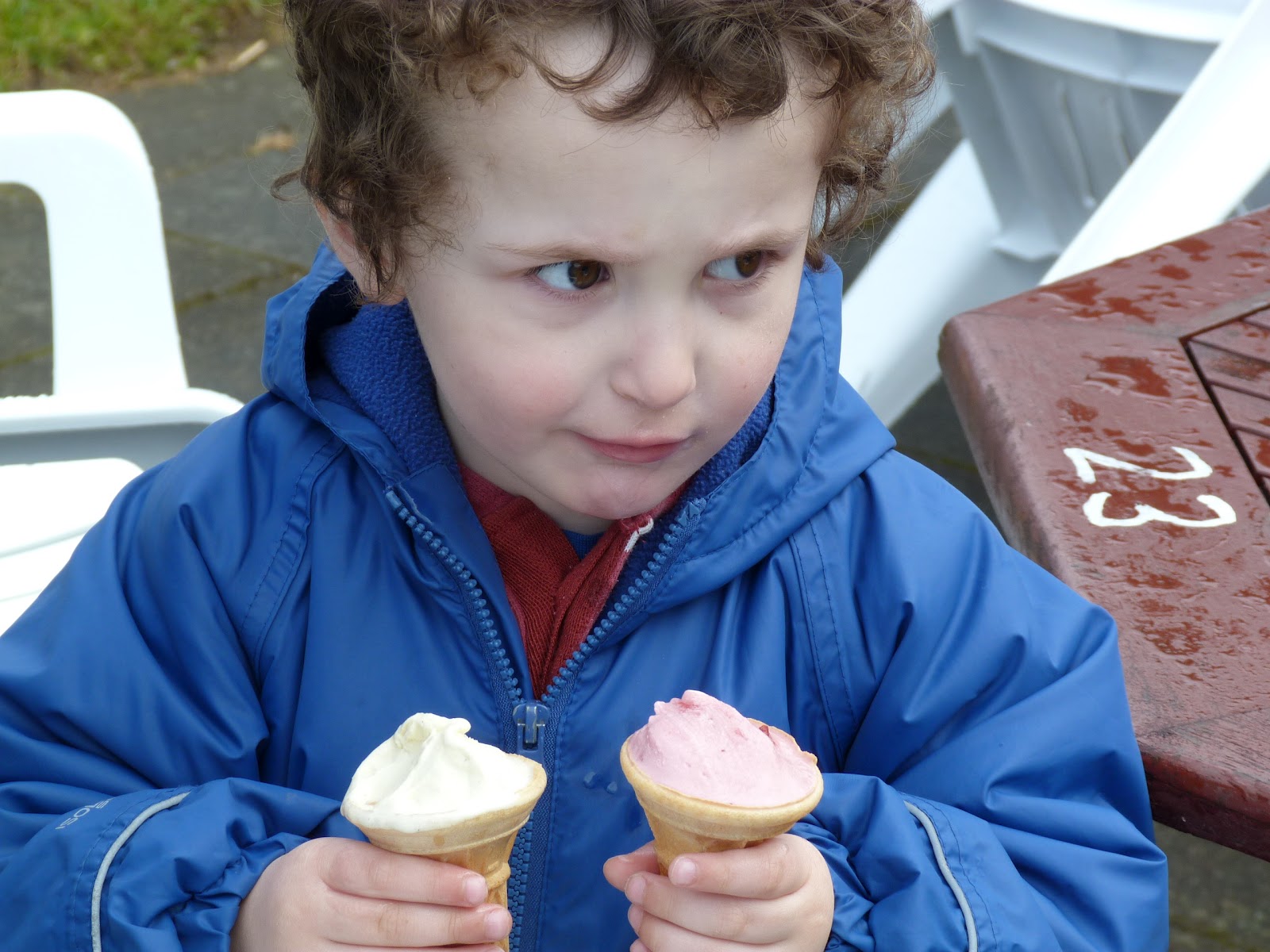 small boy with two ice creams.