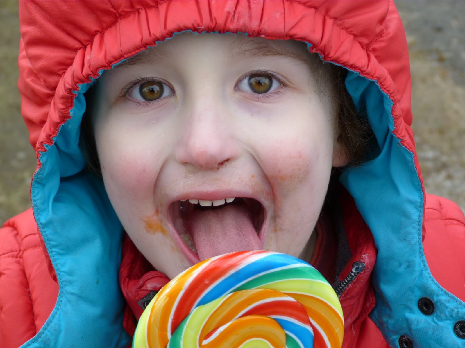 boy licking lollypop