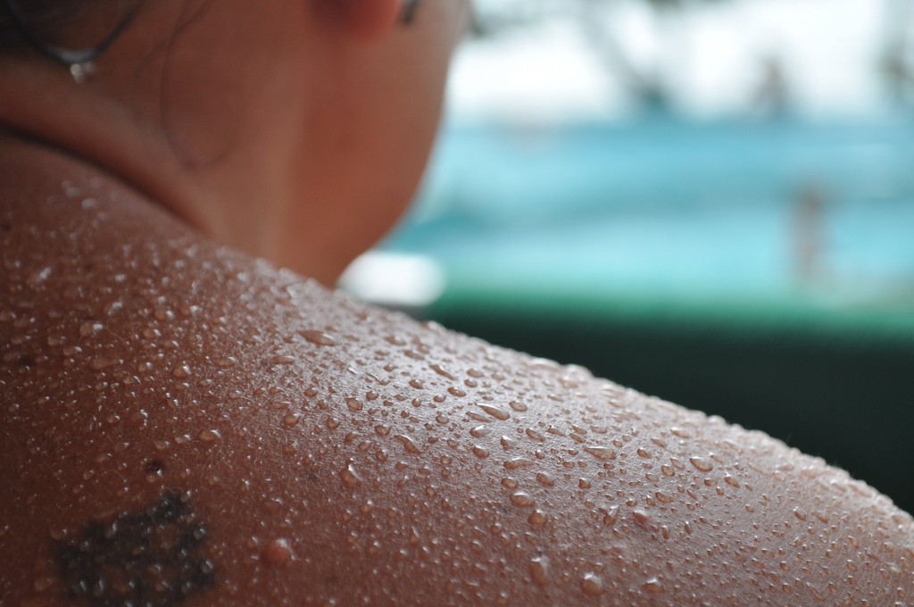 beads of sweat on a shoulder 