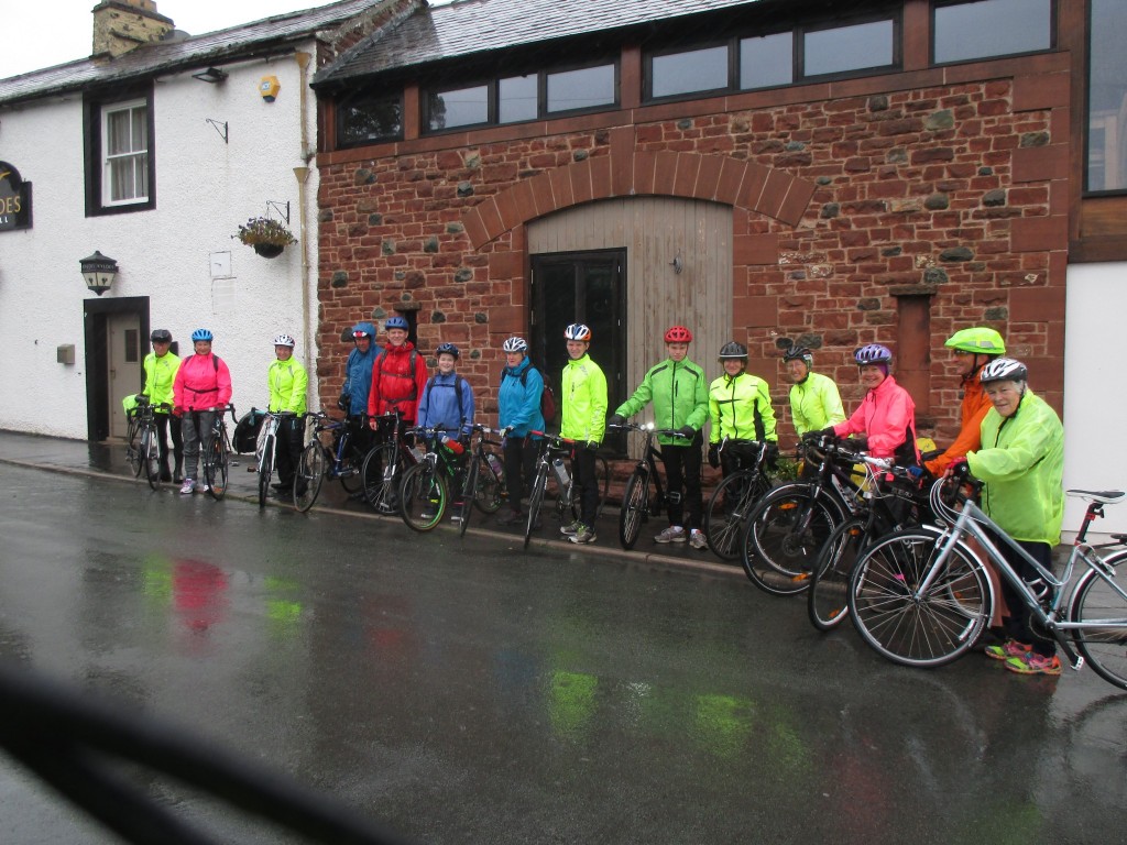 Setting out - The start, notice how the high-viz jackets reflect in the rain. 